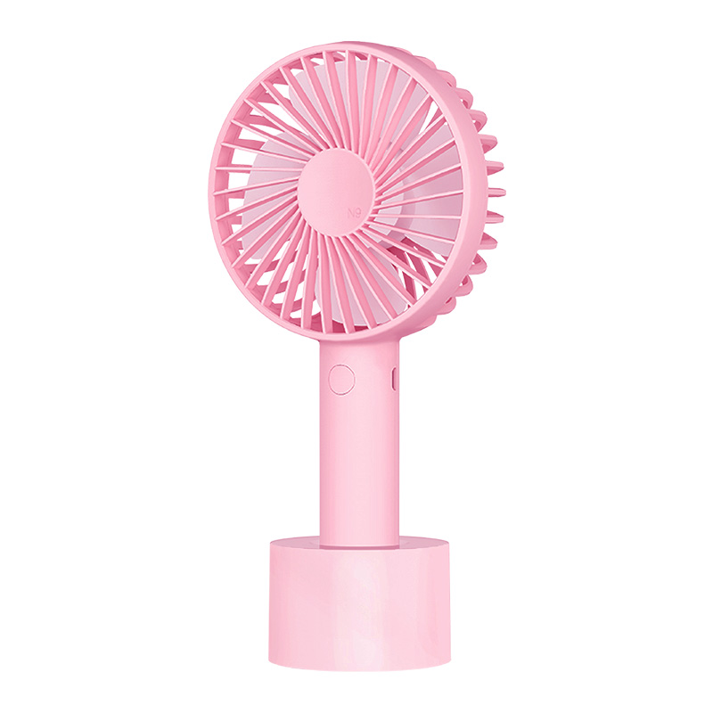 Ufficio per lo shopping all'aperto che lavora alle signore popolari con il mini ventilatore portatile tenuto in mano pratico del diffusore dell'aroma