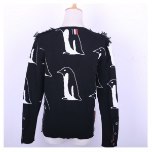 Maglioni di pullover con frange a nappa in lana con motivo a pinguino in lana da donna
