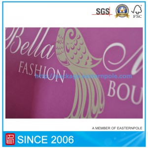 Sacchetto di carta viola con manico annodato