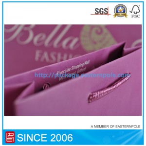 Sacchetto di carta viola con manico annodato