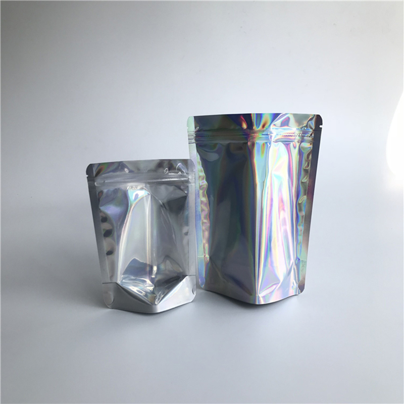 Sacchetti della chiusura lampo cosmetici di plastica laminati sacchetti trasparenti olografici anteriori richiudibili all'ingrosso che imballano in azione