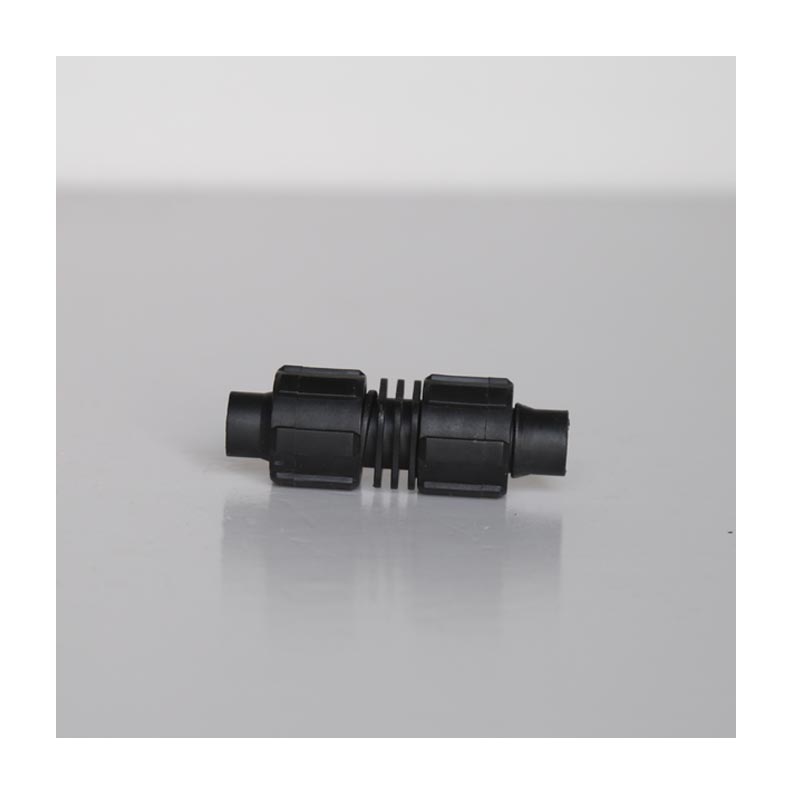 Blocco di connessione per nastro a goccia/tubo