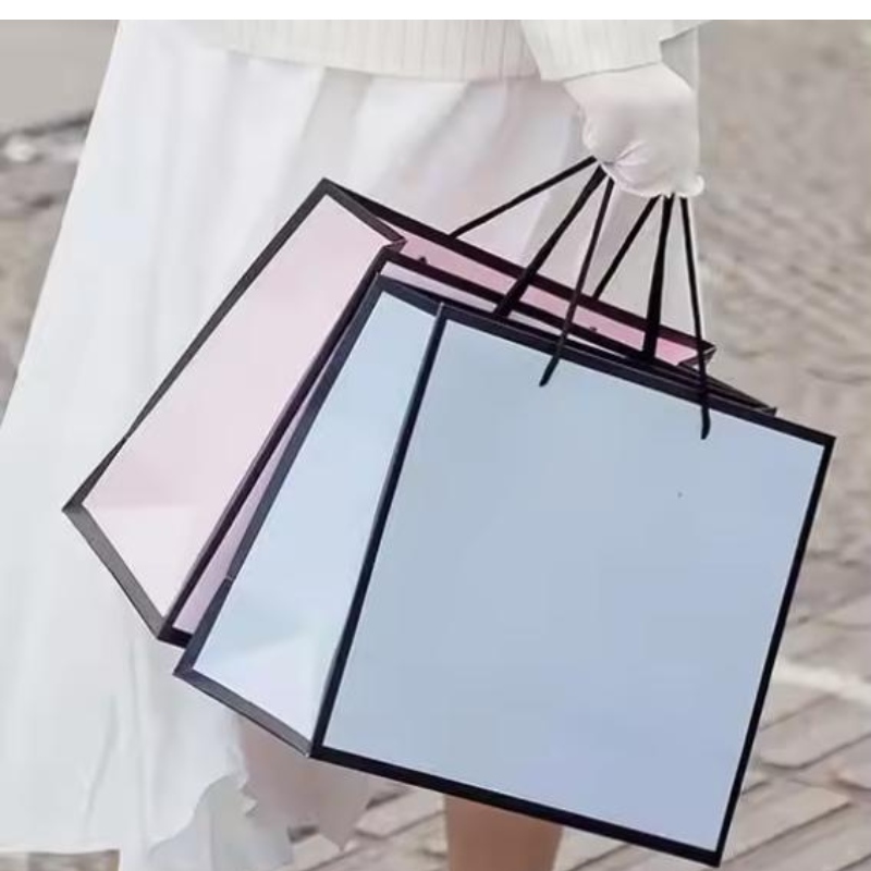 Borsa da imballaggio al dettaglio di abbigliamento di lusso personalizzato Bolsas DE Shopping Bolsas DE Shopping Paper Shopping con manici per vestiti